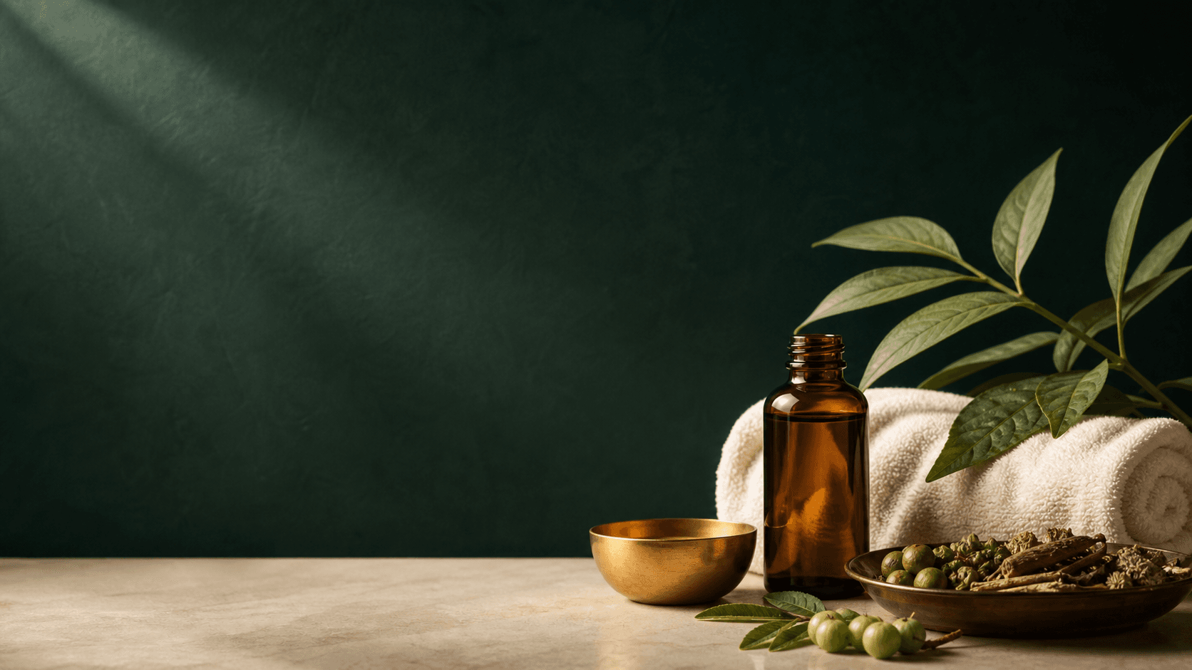 Ayurvedic wellness oils, herbs and warm treatment essentials